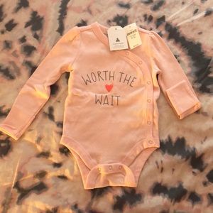 Onesie with stretch protection cuffs